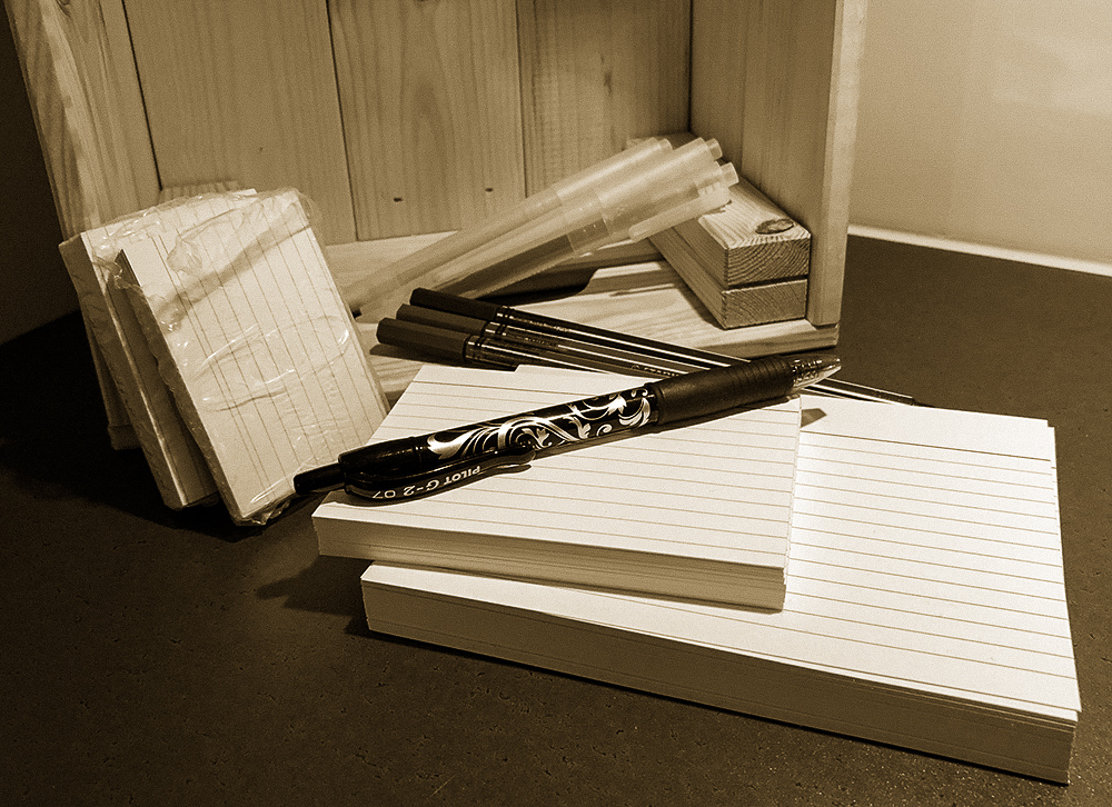 Stack of notecards, pens and highliters.